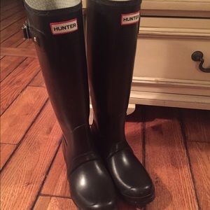 Tall black hunter boots