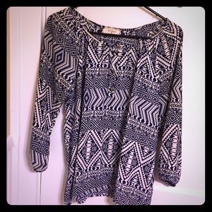 Blue and white patterned top.