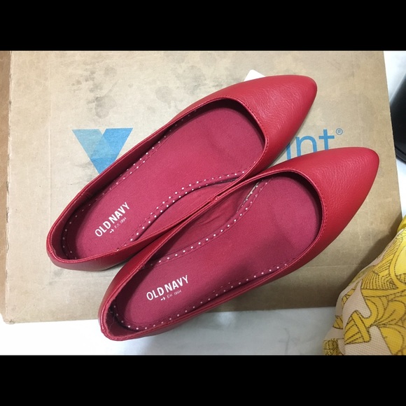 Red painted toe flat.