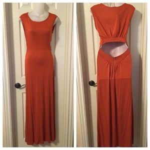 Form fitting orange maxi dress with back cut-out