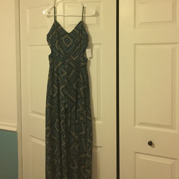 Romper with maxi overlay and side cut outs.