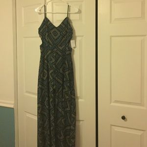 Romper with maxi overlay and side cut outs.