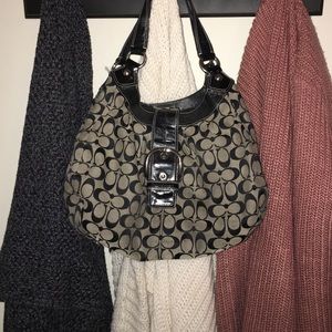 Authentic black and creme coach shoulder bag