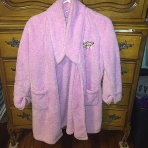 Pink fluffy robe with small money on left side