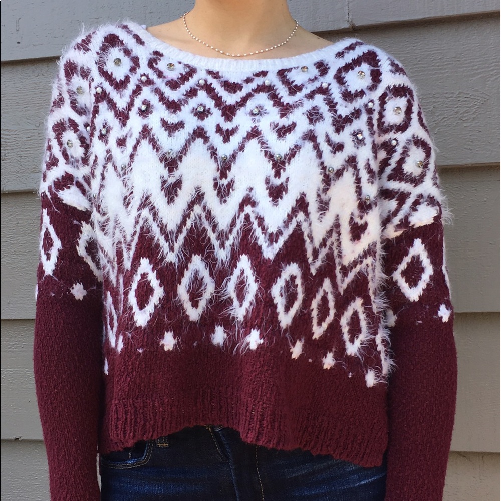 Red and white patterned sweater