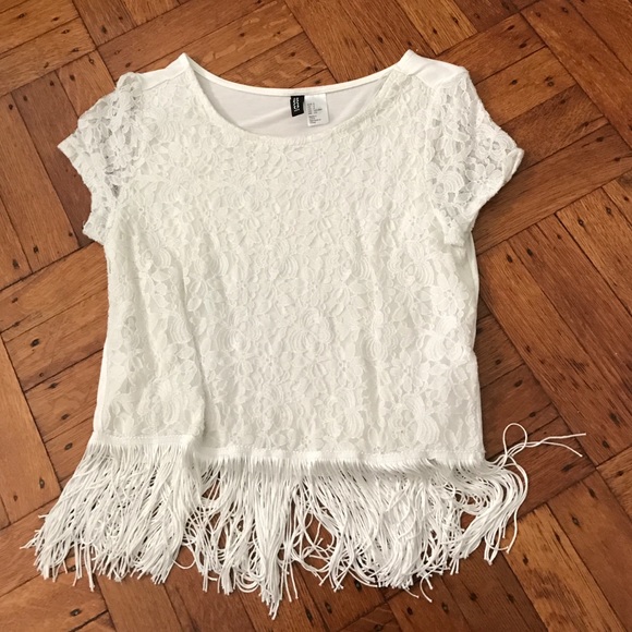 A white lace shirt with fringe.