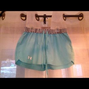 Under Armour running shorts.