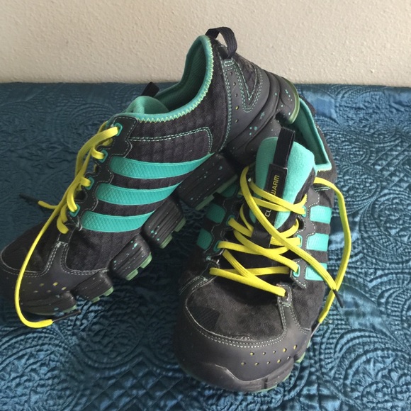 Used black, green and yellow Adidas shoes