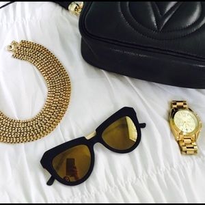 Black and gold mirrored Komono sunglasses!