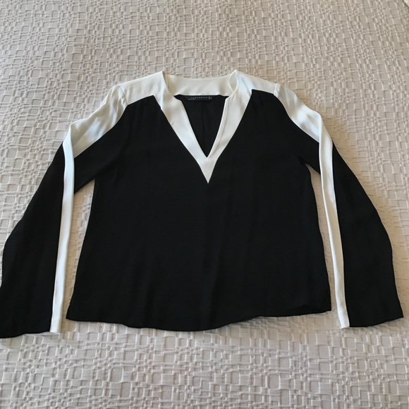Zara black and white v-neck long-sleeve blouse.