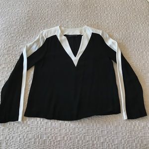 Zara black and white v-neck long-sleeve blouse.