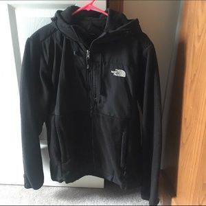 Women's Black North Face jacket with hood.