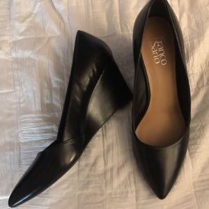 Black wedge pointed toe heels.
