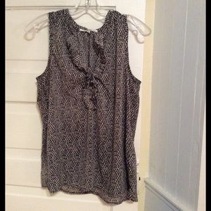 Sleeveless top with ruffle neckline