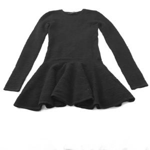 A black dress with a bottom ruffle