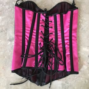 Hot pink and black zip-up corset.