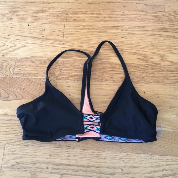 Black swimsuit top with tribal printed detailing.