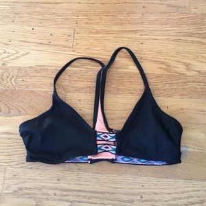 Black swimsuit top with tribal printed detailing.