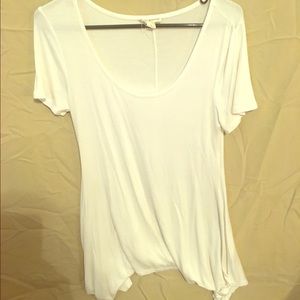 White scoop neck shirt.