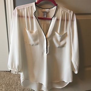 Cream blouse with black trim