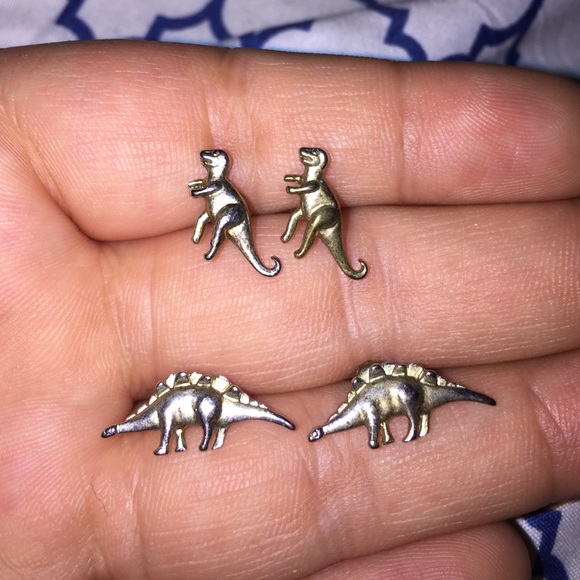 TWO pairs of dinosaur earrings