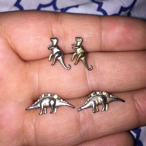 TWO pairs of dinosaur earrings