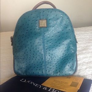 Dooney and Bourke blue embossed leather backpack.