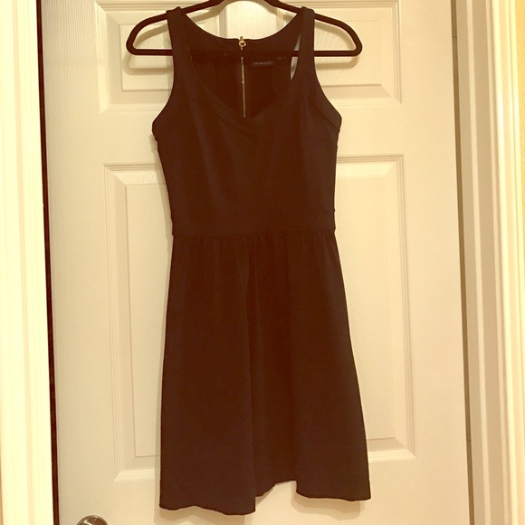 Black Dress with Pockets and zipper back.