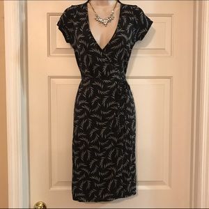 Black and silver Wrap dress with leafy print.