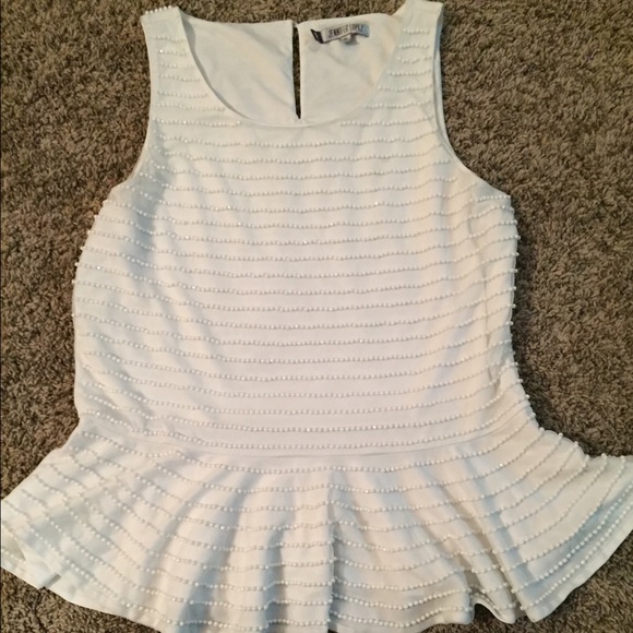 Elegant white beaded sleeveless blouse