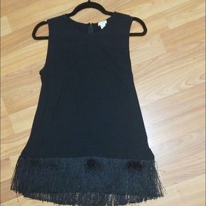Sleeveless top with fringe detail at waist