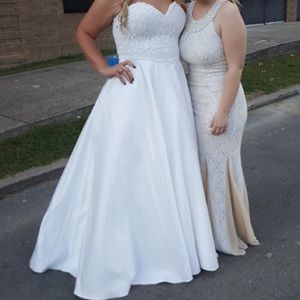 Beautiful dress that's on the LEFT.