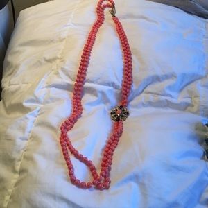 Coral colored long necklace