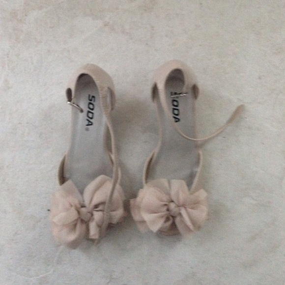 I'm selling a beige pair of soda shoes for kids.