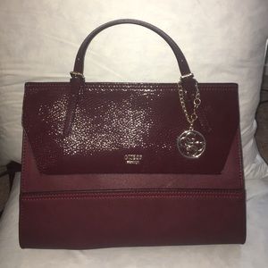 2016 Maroon/Wine red Guess purse.