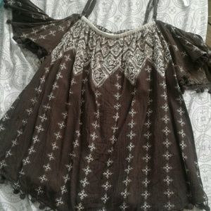 Brown off the shoulder shirt.