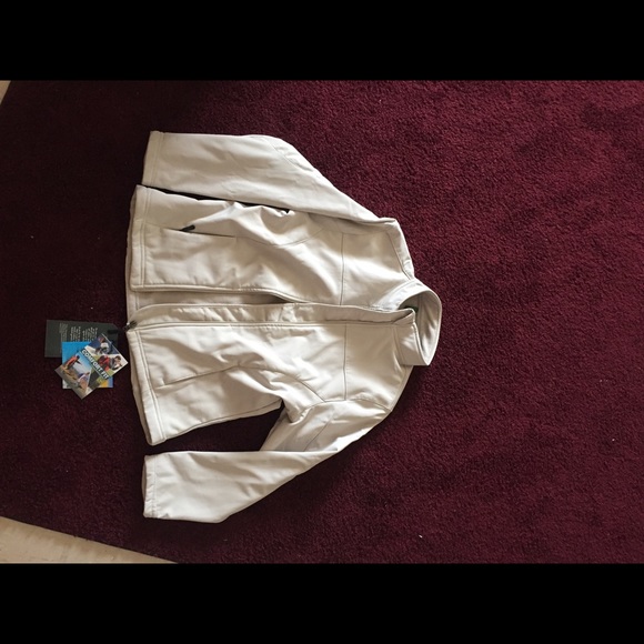 A cream jacket, that is water/wind resistant.