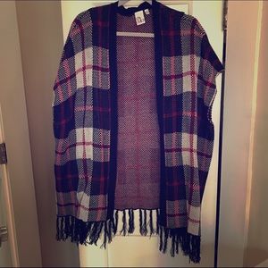 Red black and white plaid poncho with fringe