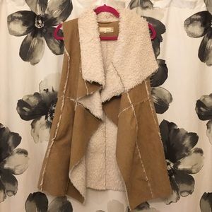 Winter vest with faux shearling lining.