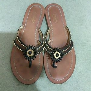 Woman's Coach black and gold sandals. 8B