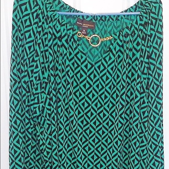 Emerald green and black tunic. Gold detail at neck
