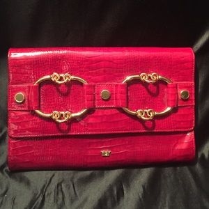 Red clutch with gold hardware