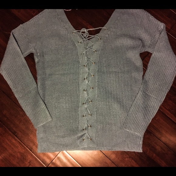 Blue sweater with lace up back
