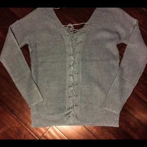 Blue sweater with lace up back