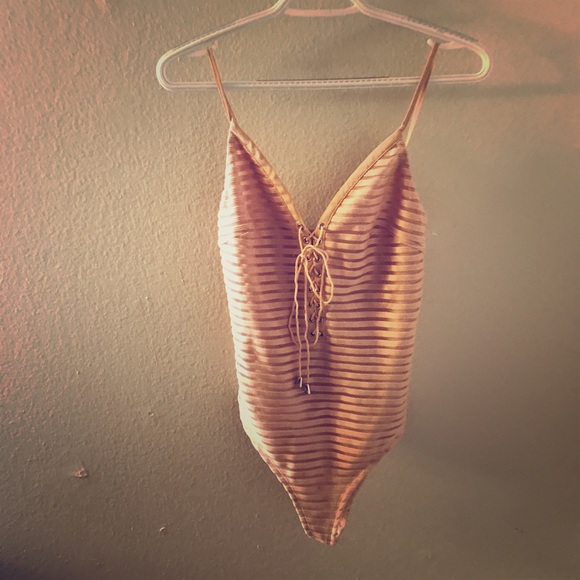 Flattering lace up bodysuit!