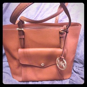 Michael Kors: jet set multifunctional brown tote.