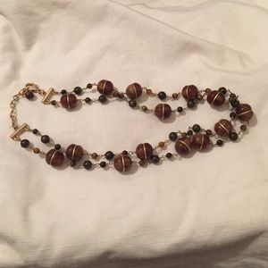 Brown beaded necklace with gold accents
