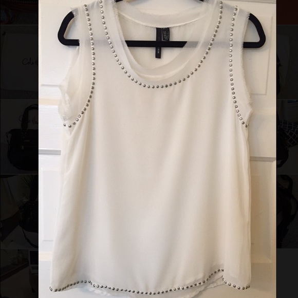 White sleeveless blouse with embellishments