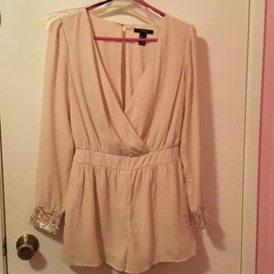 Cream romper with sequence wrists