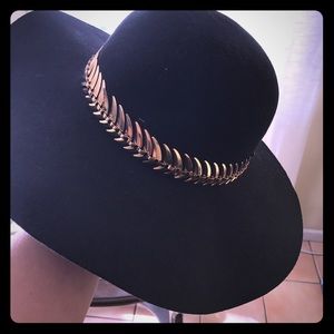 Black and gold derby hat